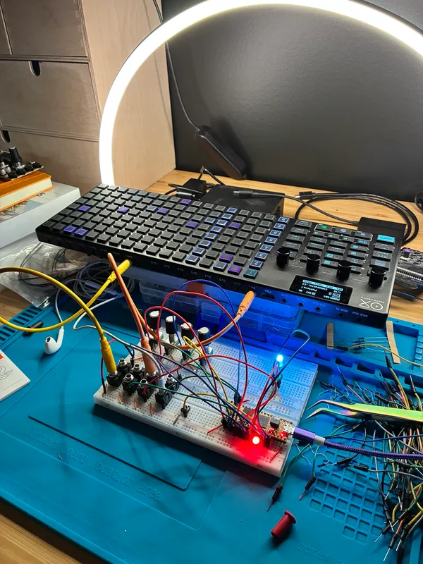 Breadboard prototype patched to an OXI One sequencer, LEDs lit